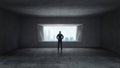 Thoughtful businessman standing in empty space concrete room