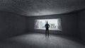 Thoughtful businessman standing in empty space concrete room