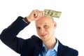 Thoughtful businessman in suit on white background holding cash. Thinking about making money. Royalty Free Stock Photo