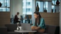 Thoughtful businesswoman calling phone office lounge closeup. Woman using laptop Royalty Free Stock Photo