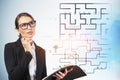 Thoughtful businesswoman and digital maze