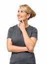 Thoughtful Businesswoman With Hand On Chin Smiling