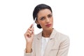 Thoughtful businesswoman holding a pen Royalty Free Stock Photo