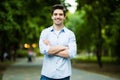 Thoughtful casual young man outdoors looking up and smiling Royalty Free Stock Photo