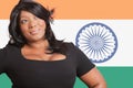 Thoughtful casual mixed race woman over Indian flag