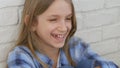 Thoughtful Child Portrait, Laughing Kid Face Looking in Camera Blonde Bored Girl Royalty Free Stock Photo