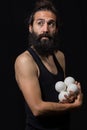 Thoughtful circus juggler miming with his juggling balls Royalty Free Stock Photo