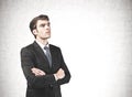 Thoughtful confident businessman with crossed arms Royalty Free Stock Photo