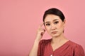 Thoughtful confused and dizzy asian woman, Girl`s face expression feeling worry. Royalty Free Stock Photo