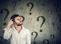 Thoughtful confused man has too many questions and no answer Royalty Free Stock Photo