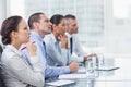 Thoughtful coworkers listening to presentation Royalty Free Stock Photo