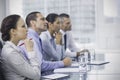 Thoughtful coworkers listening to presentation Royalty Free Stock Photo