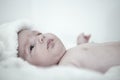 Thoughtful cute baby lies on back Royalty Free Stock Photo