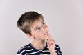Thoughtful cute young boy looking up Royalty Free Stock Photo