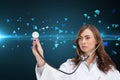Thoughtful doctor using stethoscope Royalty Free Stock Photo