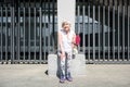 Thoughtful elderly woman relaxing after physical activities outdoor Royalty Free Stock Photo