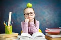 Thoughtful Elementary School Girl Apple on Head