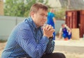 Thoughtful engineer sitting on a building site