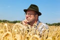 Thoughtful farmer in a corn field Royalty Free Stock Photo