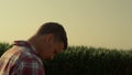 Thoughtful farmer walking field in morning sunlight closeup. Upset man consider