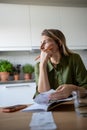 Thoughtful female analysing budget, verifying income and expenses, thinking while looking at window Royalty Free Stock Photo