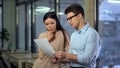 Thoughtful female manager looking at report, outraged by exit poll results