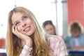 Thoughtful female student in classroom Royalty Free Stock Photo