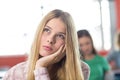 Thoughtful female student in classroom Royalty Free Stock Photo