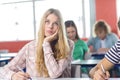 Thoughtful female student in classroom Royalty Free Stock Photo