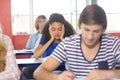 Thoughtful female student in classroom Royalty Free Stock Photo