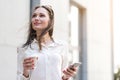 Thoughtful female typing in phone Royalty Free Stock Photo