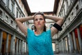 Thoughtful fitness woman near uffizi gallery in florence, italy Royalty Free Stock Photo