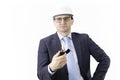 Thoughtful focused on handsome engineer in white helmet holds burning lighter Royalty Free Stock Photo
