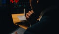 Thoughtful focused successful caucasian male stock investor, broker, financial adviser, sits at work desk, looks at computer, Royalty Free Stock Photo