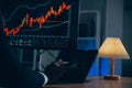 Thoughtful focused successful caucasian male stock investor, broker, financial adviser, sits at work desk, looks at computer, Royalty Free Stock Photo