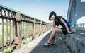 Thoughtful girl on a bridge Royalty Free Stock Photo