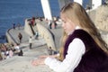 Thoughtful girl child on the waterfront Royalty Free Stock Photo