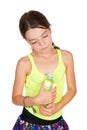 Thoughtful Girl Holding Bottle of Mineral Water