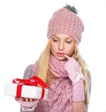 Thoughtful girl looking on christmas present box Royalty Free Stock Photo