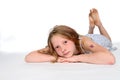 Thoughtful girl on stomach Royalty Free Stock Photo