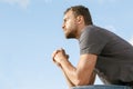 Thoughtful handsome man in a park Royalty Free Stock Photo