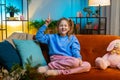 Thoughtful inspired child girl kid make Eureka gesture raises finger came up with creative plan