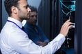 Thoughtful intelligent man looking at the wires Royalty Free Stock Photo