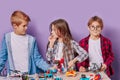 Thoughtful kids practive engineering together in studio Royalty Free Stock Photo