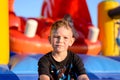 Thoughtful little boy in a kids playground Royalty Free Stock Photo