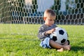 Thoughtful little boy with a soccer Royalty Free Stock Photo