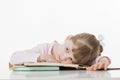 Thoughtful little girl with a books