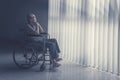 Thoughtful senior man sitting on wheelchair Royalty Free Stock Photo