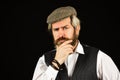Thoughtful male vintage fashion. businessman farmer with dyed blonde beard. retro man in peaked cap. Portrait of mature Royalty Free Stock Photo