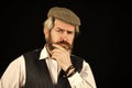 Thoughtful male vintage fashion. businessman farmer with dyed blonde beard. retro man in peaked cap. Portrait of mature Royalty Free Stock Photo